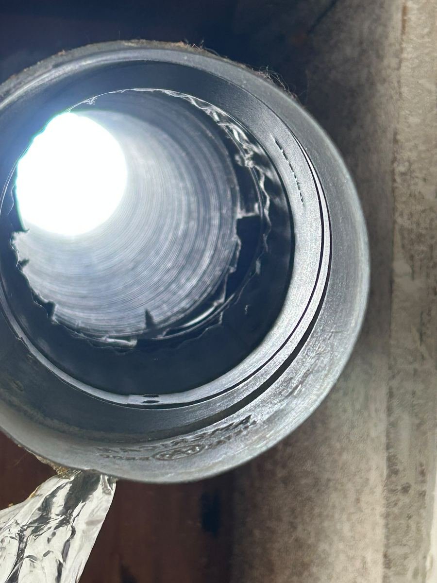 Clear dryer vent with daylight visible after cleaning